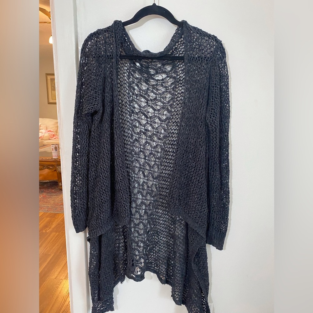 Black crocheted sweater. Short front and lower back.
